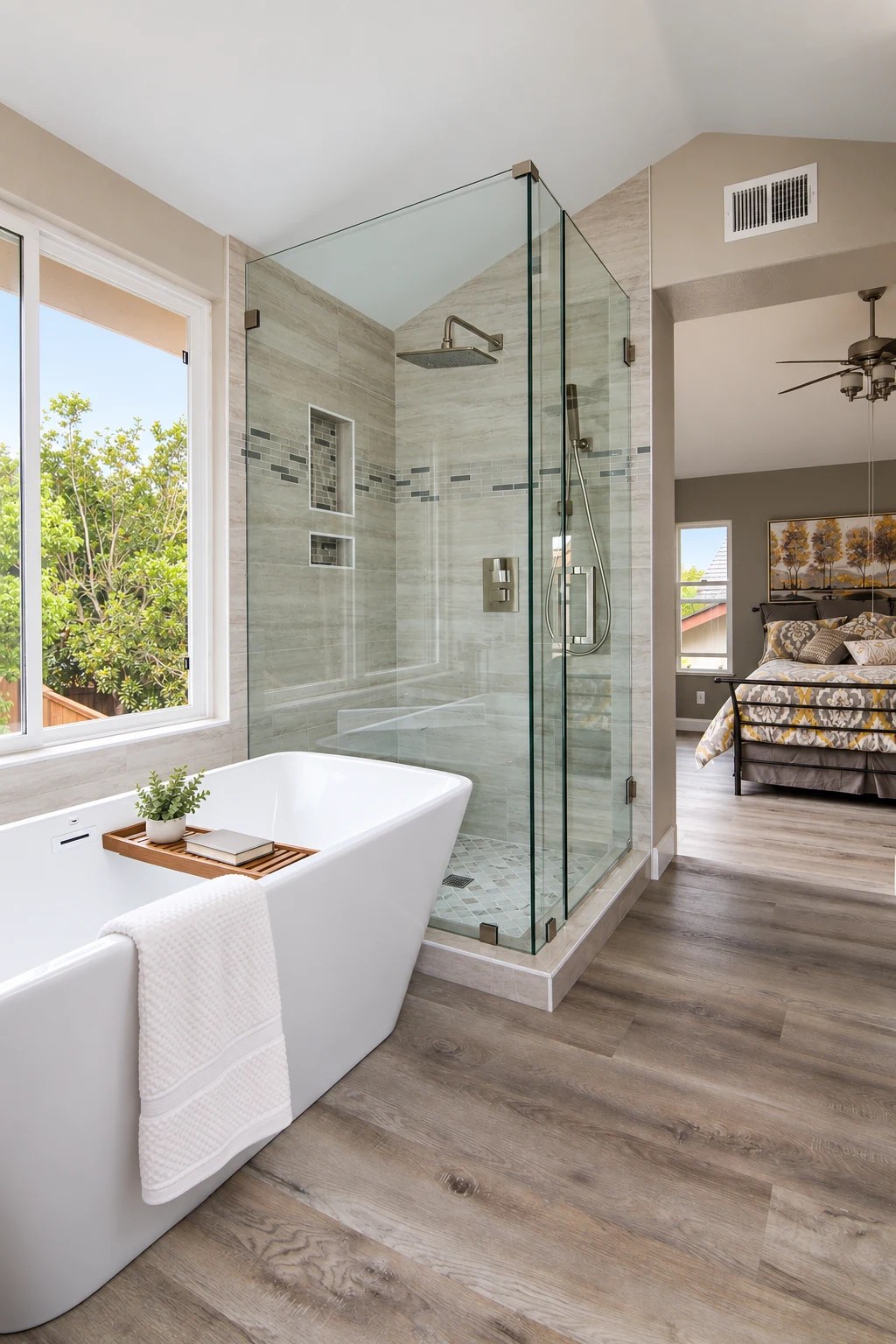 Davis bathroom with a freestanding tub, glass shower and natural light; virtually staged